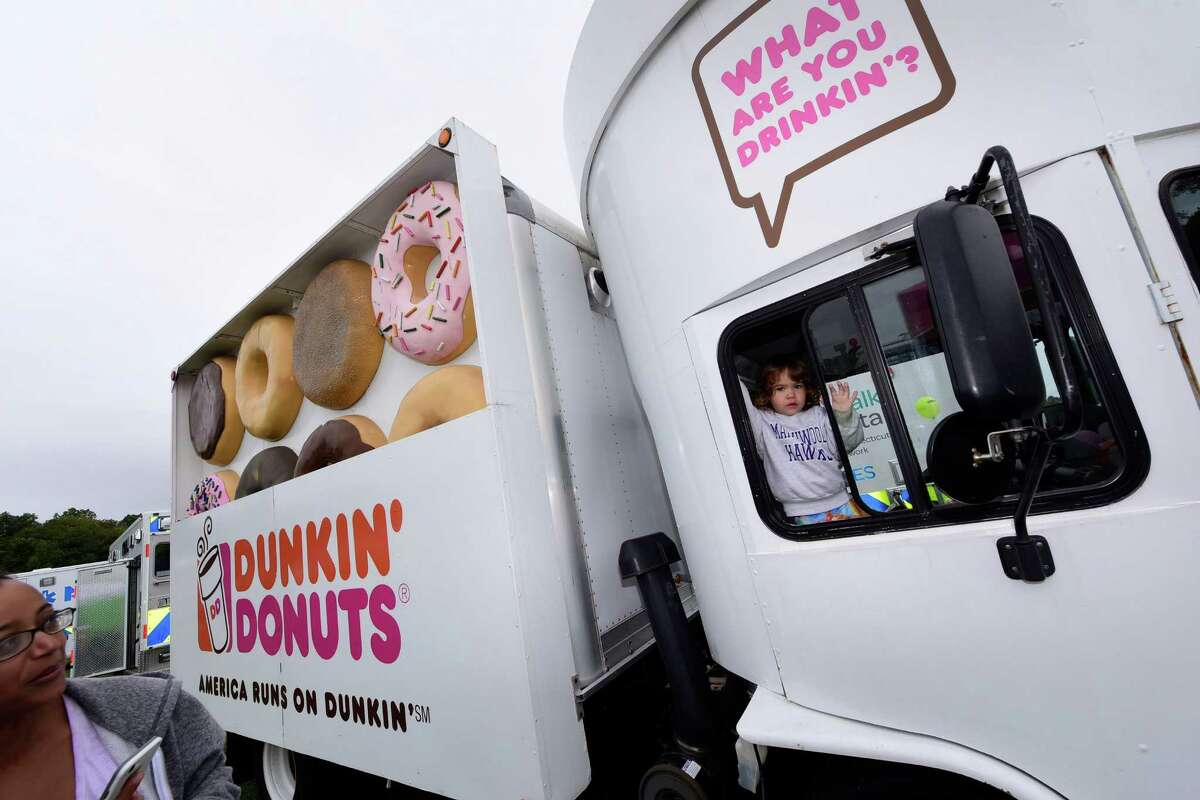 Rebecca Bryant, 3, climbs aboard the Dunkin' Donuts truck during The Human Services Council?’s 5th Annual KIDZFEST Touch-A-Truck & More Fundraiser to benefit Children?’s Connection Saturday, October 8, 2016, at Taylor Farm Park, in Norwalk, Conn. KIDZFEST offers an opportunity for families to explore construction, emergency and recreation vehicles of all sizes as well as enjoy train rides, face painting, characters meet and greet, food, and games.