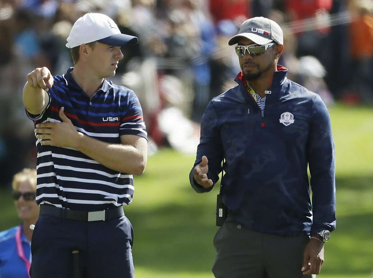 United States vice-captain Tiger Woods talks to United States?’ Jordan Spieth on the 16th hole during a practice round for the Ryder Cup golf tournament Thursday, Sept. 29, 2016, at Hazeltine National Golf Club in Chaska, Minn. 
