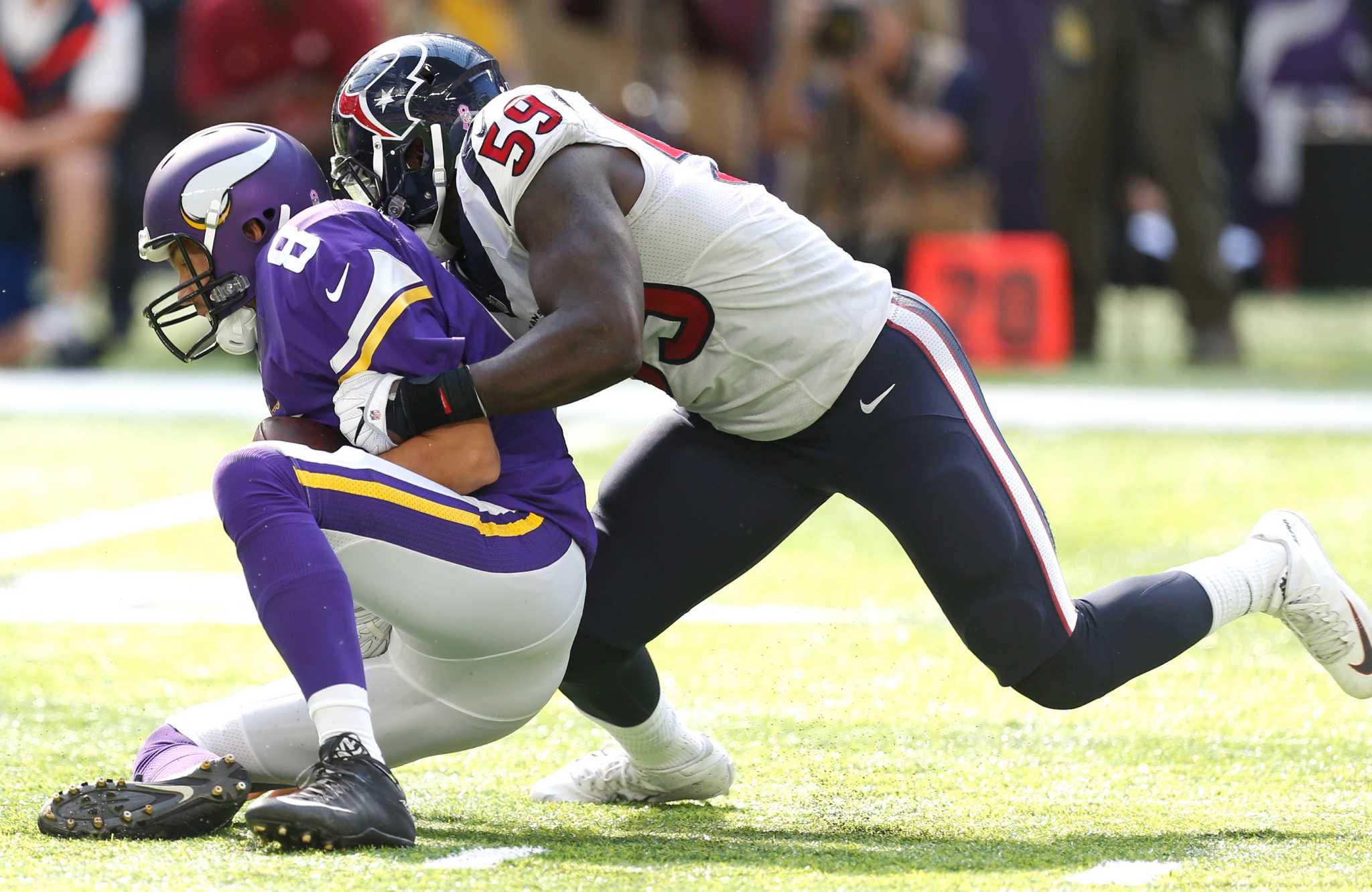 Houston Texans linebackers Jadeveon Clowney, left, and Whitney