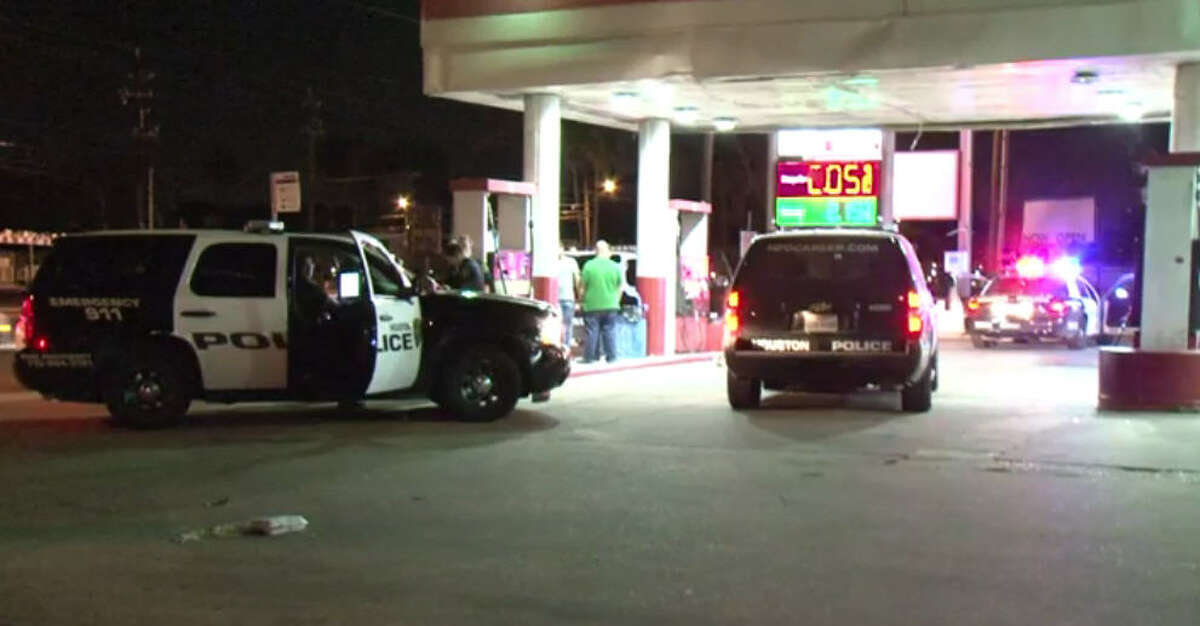 Police gather at a gas station on the west side of Houston on Oct. 9, 2016 after a fight escalated to a stabbing.