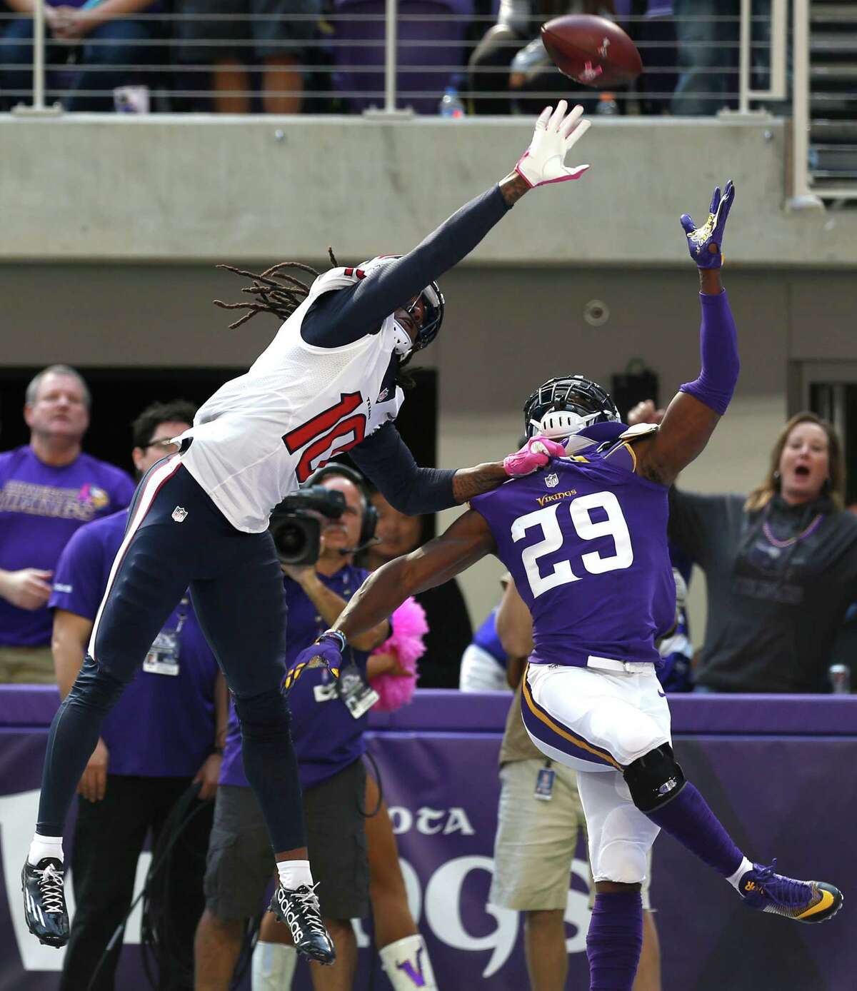Houston Texans wide receiver DeAndre Hopkins (10) can't reach a high pass in the end zone with Minnesota Vikings cornerback Xavier Rhodes (29) defending during the second quarter of an NFL football game at U.S. Bank Stadium on Sunday, Oct. 9, 2016, in Minneapolis.