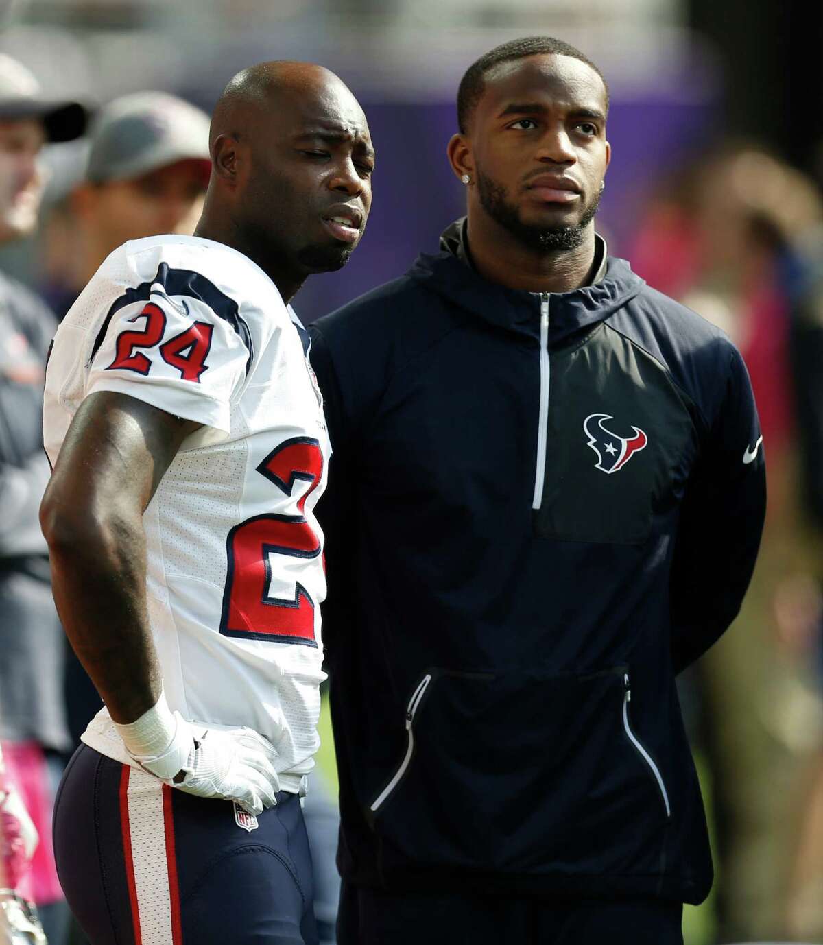 Houston Texans cornerbacks Johnathan Joseph (24) and Kareem Jackson stand on the sidelines during the second quarter of an NFL football game against the Minnesota Vikings at U.S. Bank Stadium on Sunday, Oct. 9, 2016, in Minneapolis.