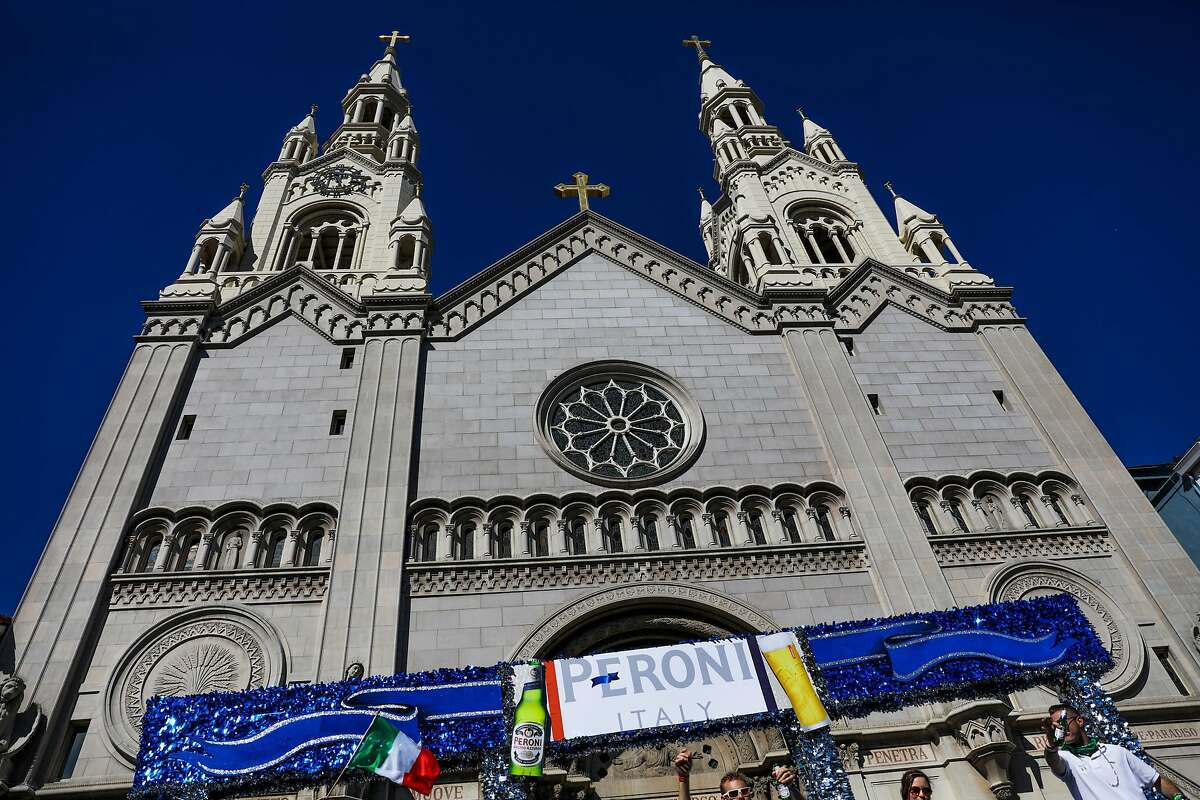 A Peroni float rides by St.Peter and Paul Church during the Italian Heritage parade, in San Francisco, California, on Sunday, Oct. 9, 2016.