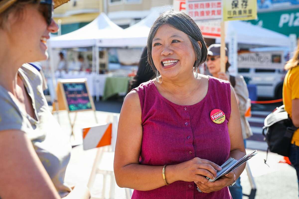 Sandra Fewer, who is running for District 1 Supervisor chats with local Corey F. (left) during the Clement Street farmers market, in San Francisco, California, on Sunday, Oct. 9, 2016.