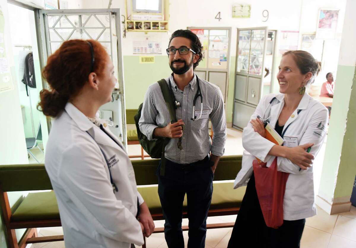 Dr. Sohi Ashraf, of Norwalk, with University of Vermont first-year medical students Mary-Kate LoPiccolo, left, of Newtown, and Alexandra Miller at St. Stephen's Hospital in the Mpererwe village of Kampala, Uganda, in July 2015. Danbury Hospital has worked with University of Vermont medical students for years and is seeking a more formal affiliation.
