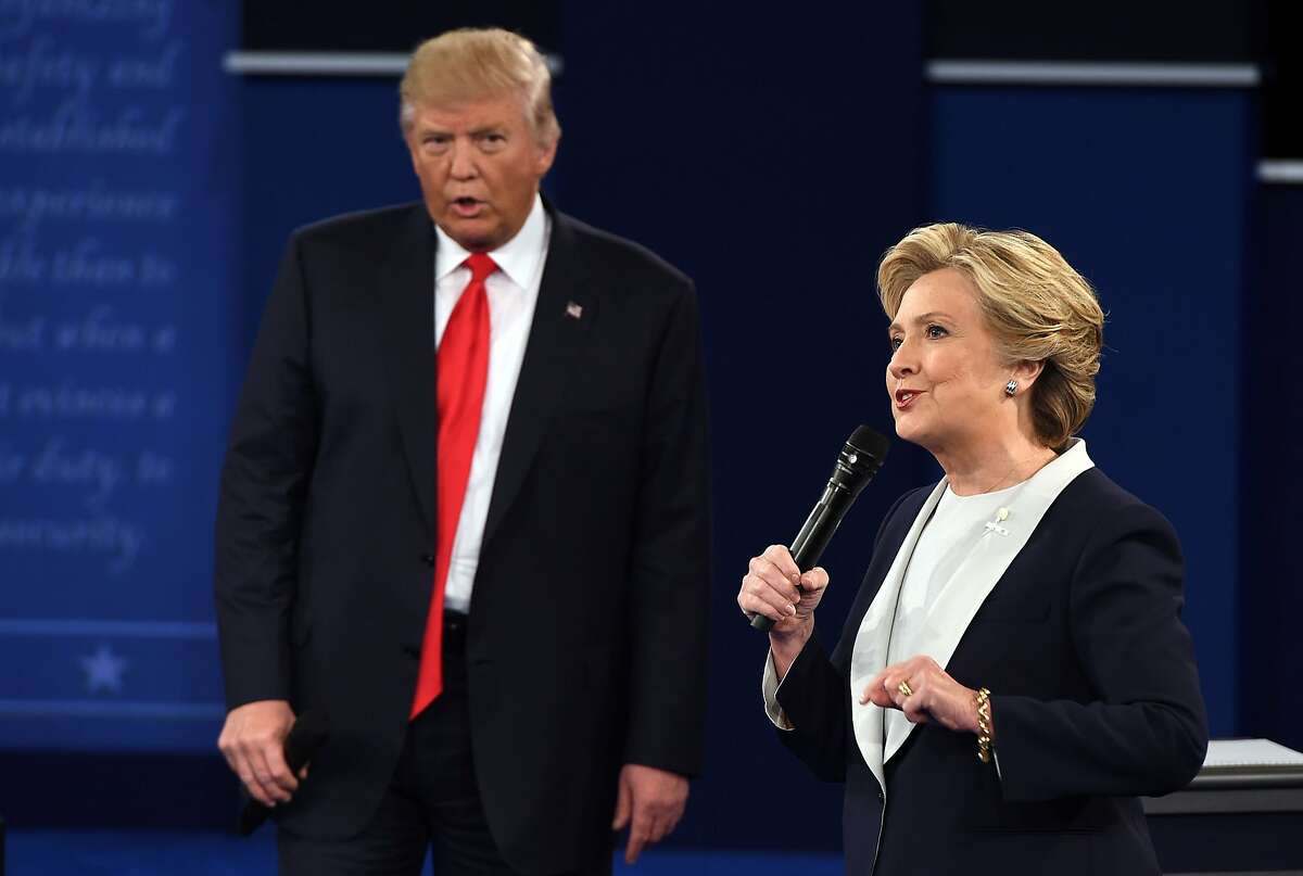 Hillary Clinton and Donald Trump debate during the second presidential debate at Washington University in St. Louis, Missouri, on October 9, 2016.