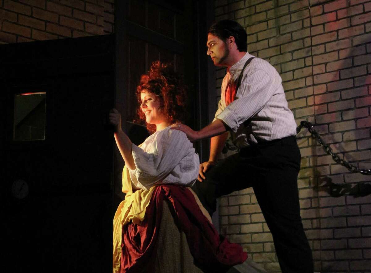 Sara Brooks (front) and Roy Bumgarner star in the Woodlawn Theatre's staging of "Sweeney Todd."