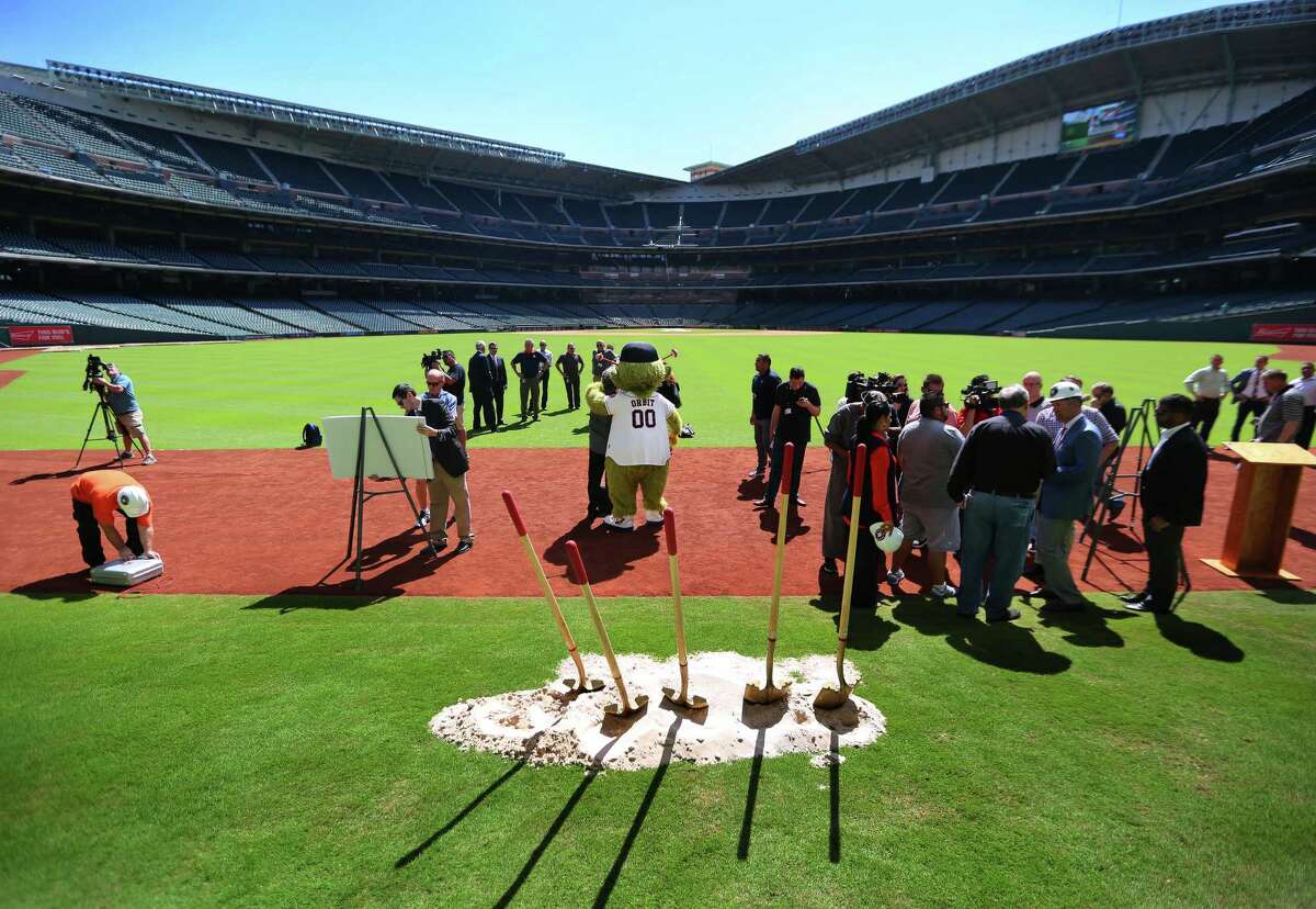 Orbit poses for pictures on Tal's Hill following a groundbreaking ceremony at Minute Maid Park that will include the destruction of the unique outfield obstacle, Monday, Oct. 10, 2016, in Houston.