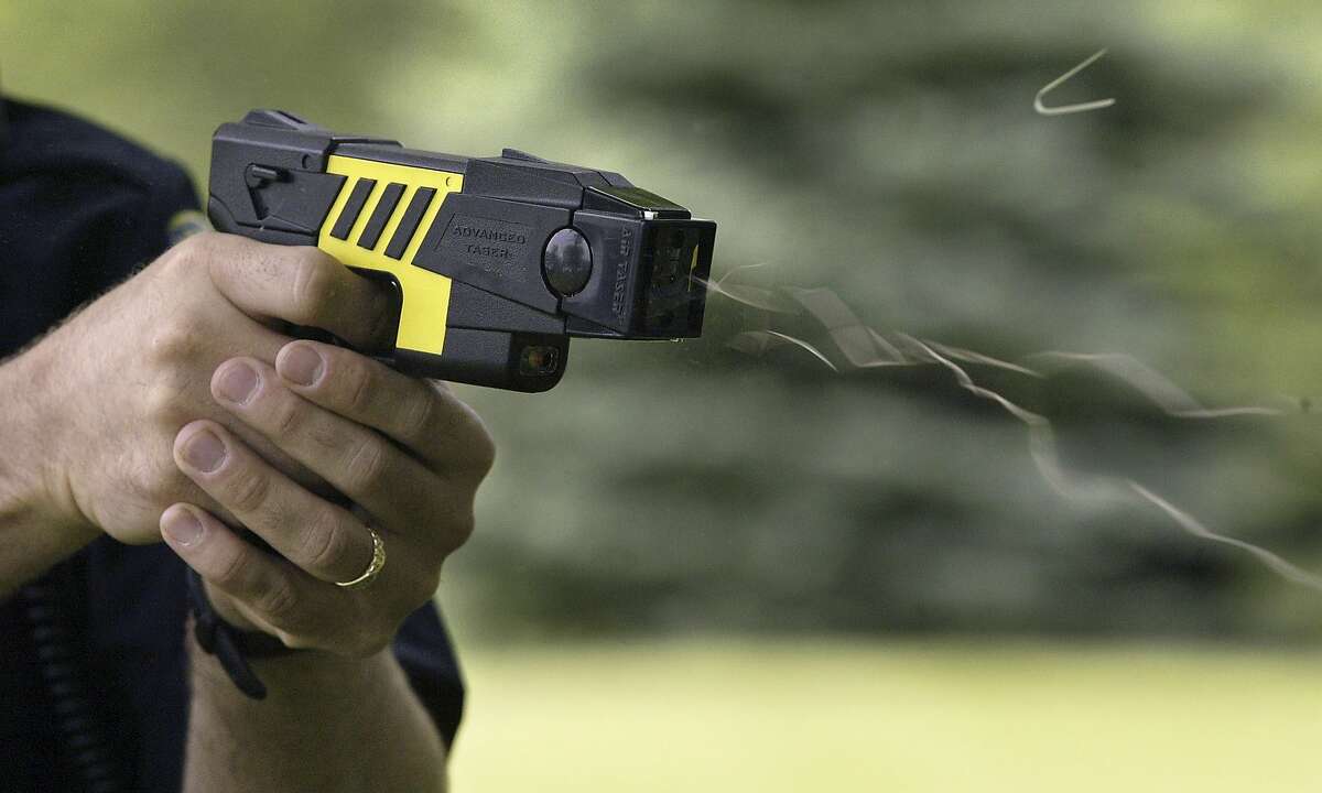 The use of the is M26 Advanced Taser is demonstrated by the Marion Police Department, Tuesday, June 7, 2004, in Marion, Iowa. The non-lethal force weapon uses Electro-Muscular Disruption to override the central nervous system. A 50,000 volt, 26-watt charge causes an uncontrollable contraction of muscle tissue. A normal hit from the Taser lasts for five seconds. The time allows officers to subdue the subject before that person can recover. (AP Photo/The Gazette, Jim Slosiarek)