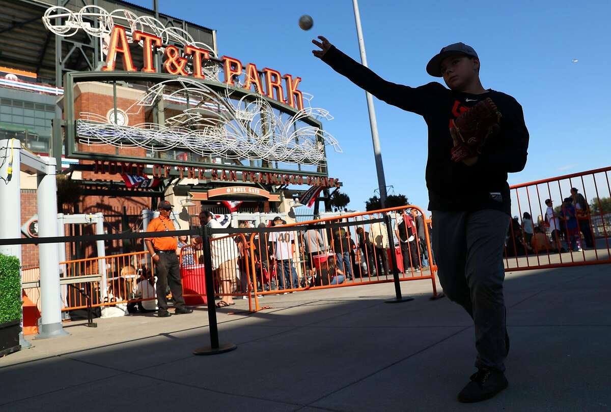 San Francisco Giants' fan Jonathan Knacke, 13, of Lincoln plays catch outside AT&T Park before Giants play Chicago Cubs in Game 3 of the National League Division Series in San Francisco, Calif., on Monday, October 10, 2016.