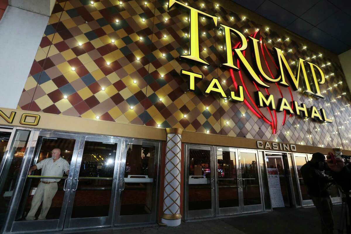 A worker measures the doorway to block the entrance at the Trump Taj Mahal on Monday, Oct. 10, 2016, in Atlantic City, N.J. The sprawling Boardwalk casino, with its soaring domes, minarets and towers built to mimic the famed Indian palace, shut down at 5:59 a.m., having failed to reach a deal with its union workers to restore health care and pension benefits that were taken away from them in bankruptcy court. (AP Photo/Mel Evans)