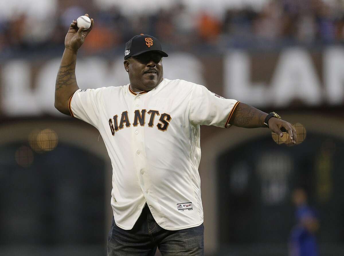 Former San Francisco Giants player Kevin Mitchell throws out the ceremonial first pitch before Game 3 of baseball's National League Division Series between the Giants and the Chicago Cubs in San Francisco, Monday, Oct. 10, 2016. (AP Photo/Ben Margot)
