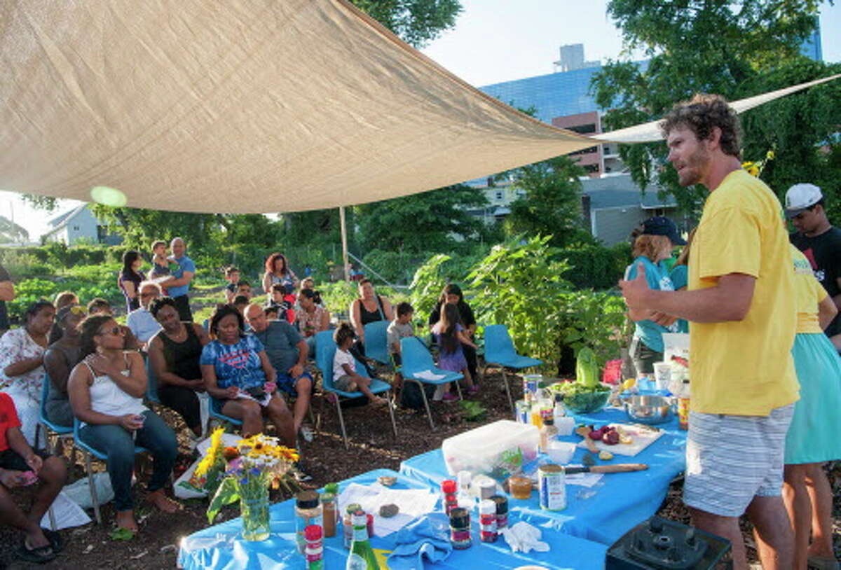 Maxon Keating, farm coordinator at Fairgate Farm, Stamford, CT, holds a cooking demonstration during a Farm to Table event held at the Farm on Wednesday, July 13, 2016. The farm will hold its Harvest Fest on Oct 22.