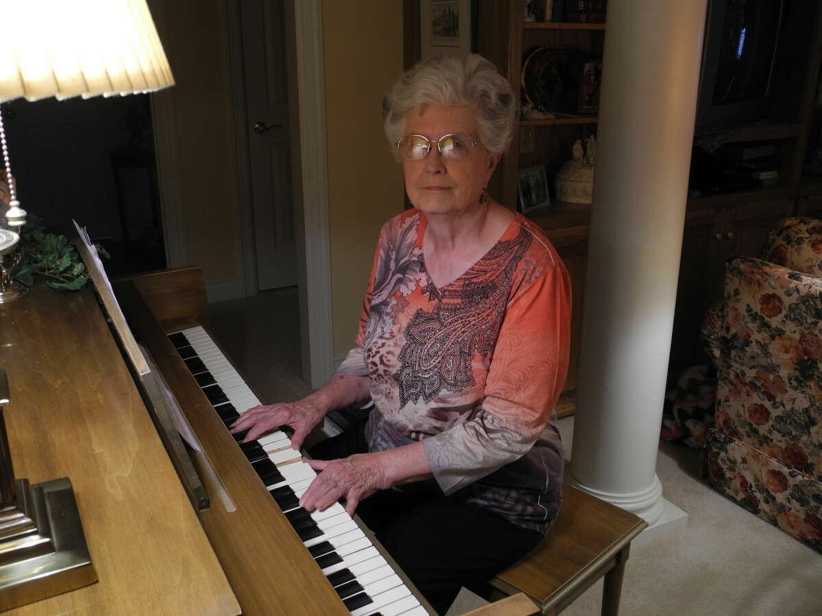 Gail M. Williams/Herald Correspondent Carolyn Warrick sits at the piano in her home. Her father and an early piano teacher “planted the seed” that led the Silver Star Award winner to become a musician.