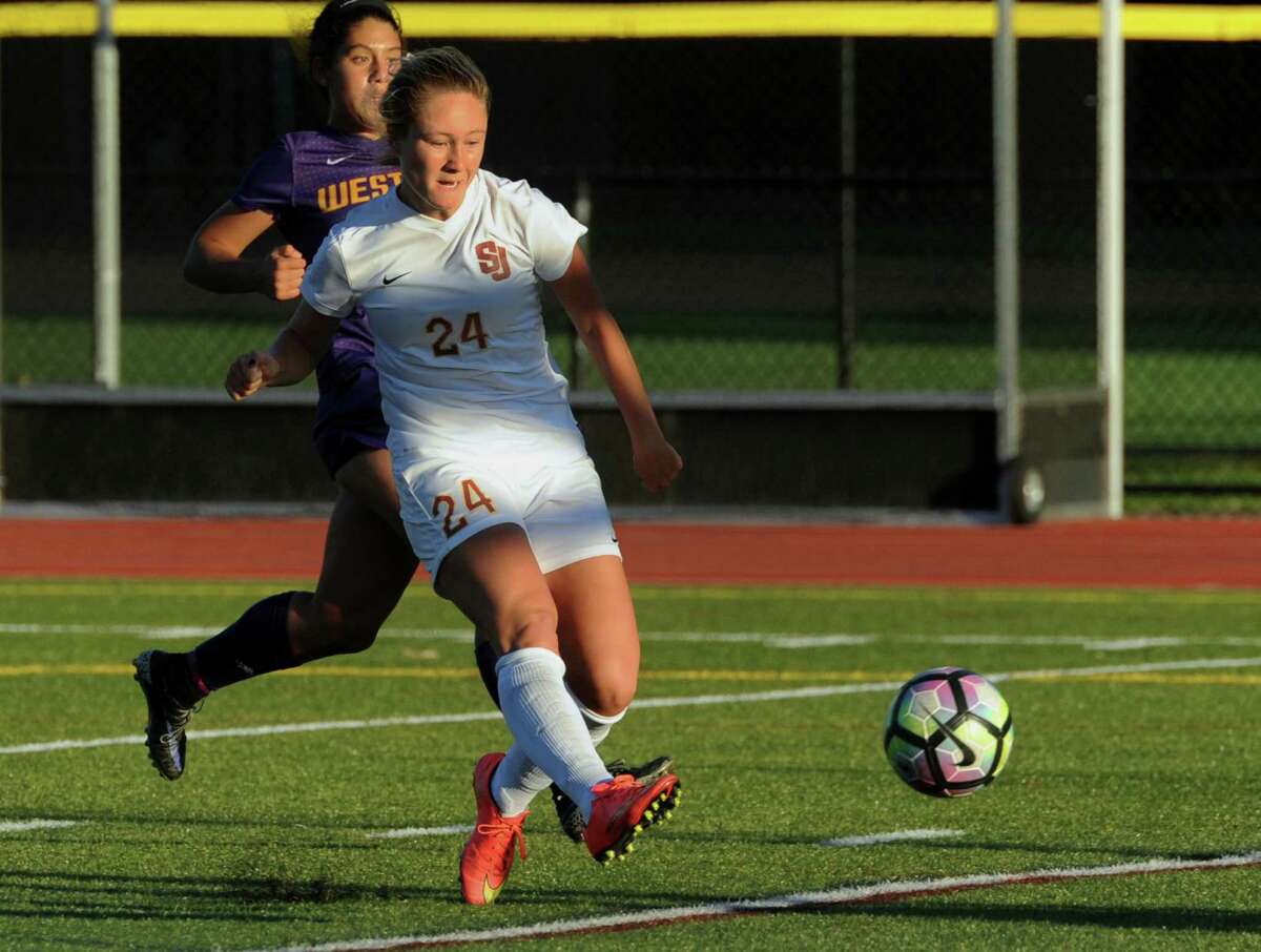 St. Joseph's Lindsey Savko kicks a goal to score against Westhill during girls soccer action in Trumbull, Conn., on Tuesday Oct. 11, 2016.