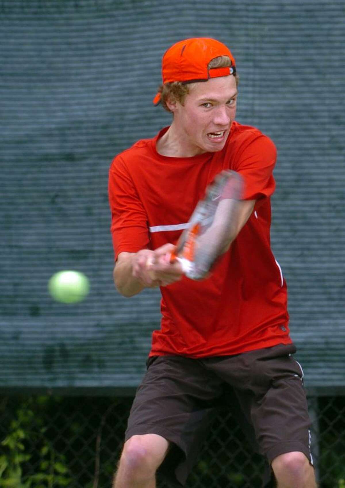 New Canaan's Ben Lee returns the ball to Staples' Danny Hirschberg during their match Tuesday May 11, 2010 in Westport.