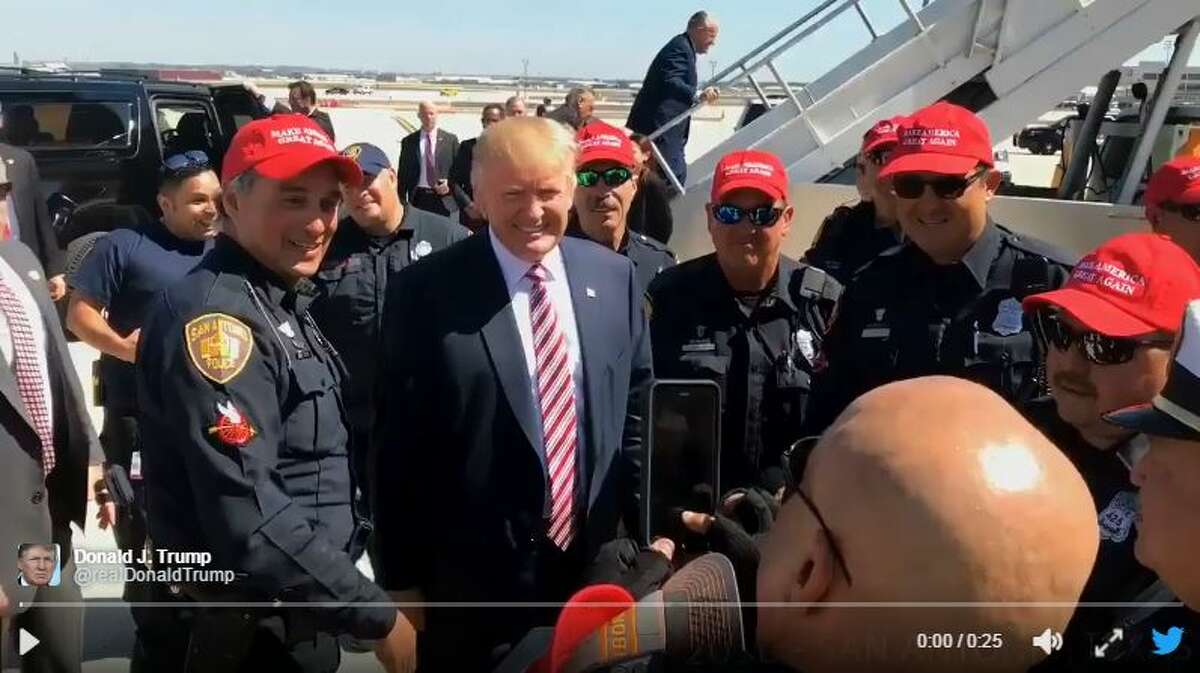 Members of the San Antonio Police Department donned "Make America Great Again" hats as Donald Trump left from the San Antonio Airport Oct. 11, 2016.