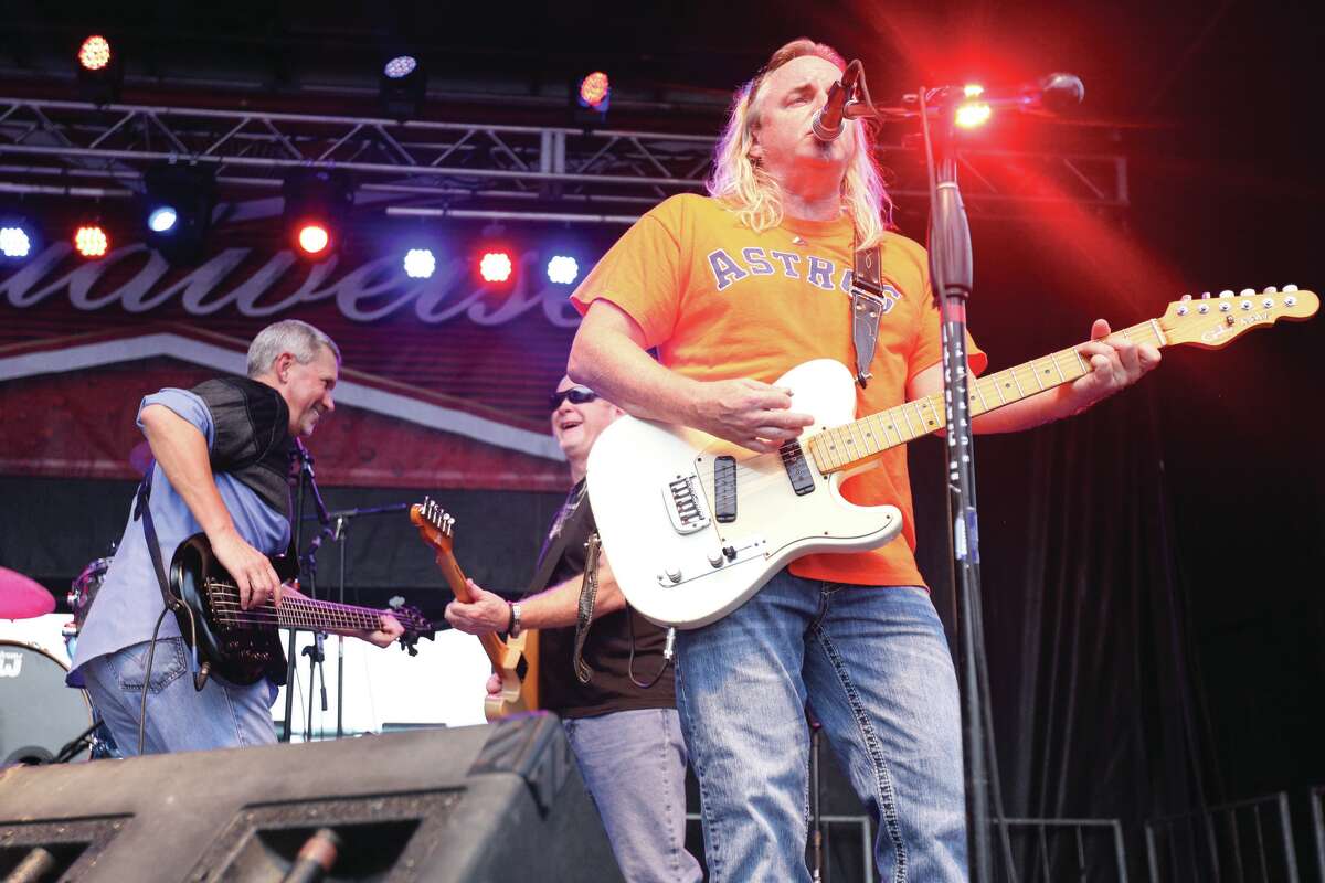 Bayou Roux performs on the Cajun Stage during the Conroe Cajun Catfish Festival in 2015 in downtown Conroe. Below, a promotional photo from Bayou Roux.