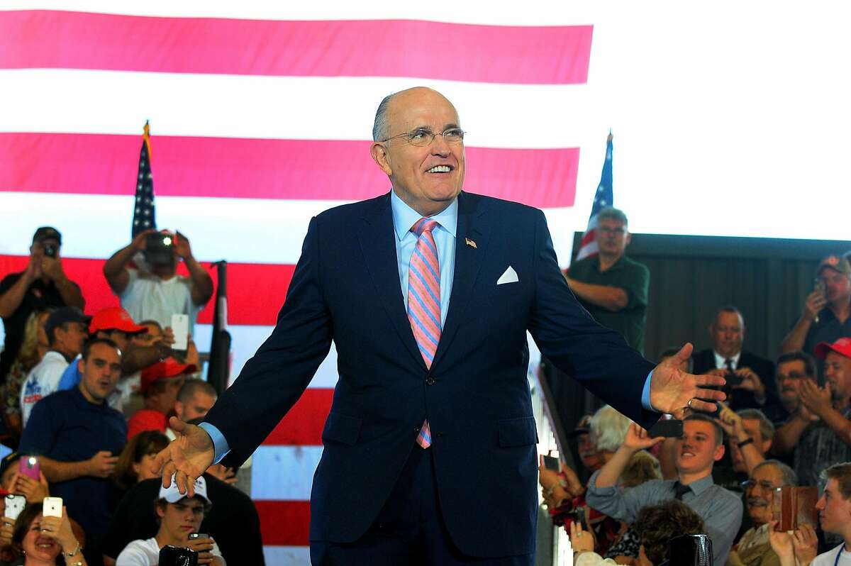 OCALA, FL - OCTOBER 12: Former New York City mayor Rudy Giuliani arrives on stage during a campaign rally for Republican presidential nominee Donald Trump at Southeastern Livestock Pavillion on October 12, 2016 in Ocala, Florida. Trump made multiple campaign stops in Florida today, a key battleground state in the upcoming election. (Photo by Gerardo Mora/Getty Images)