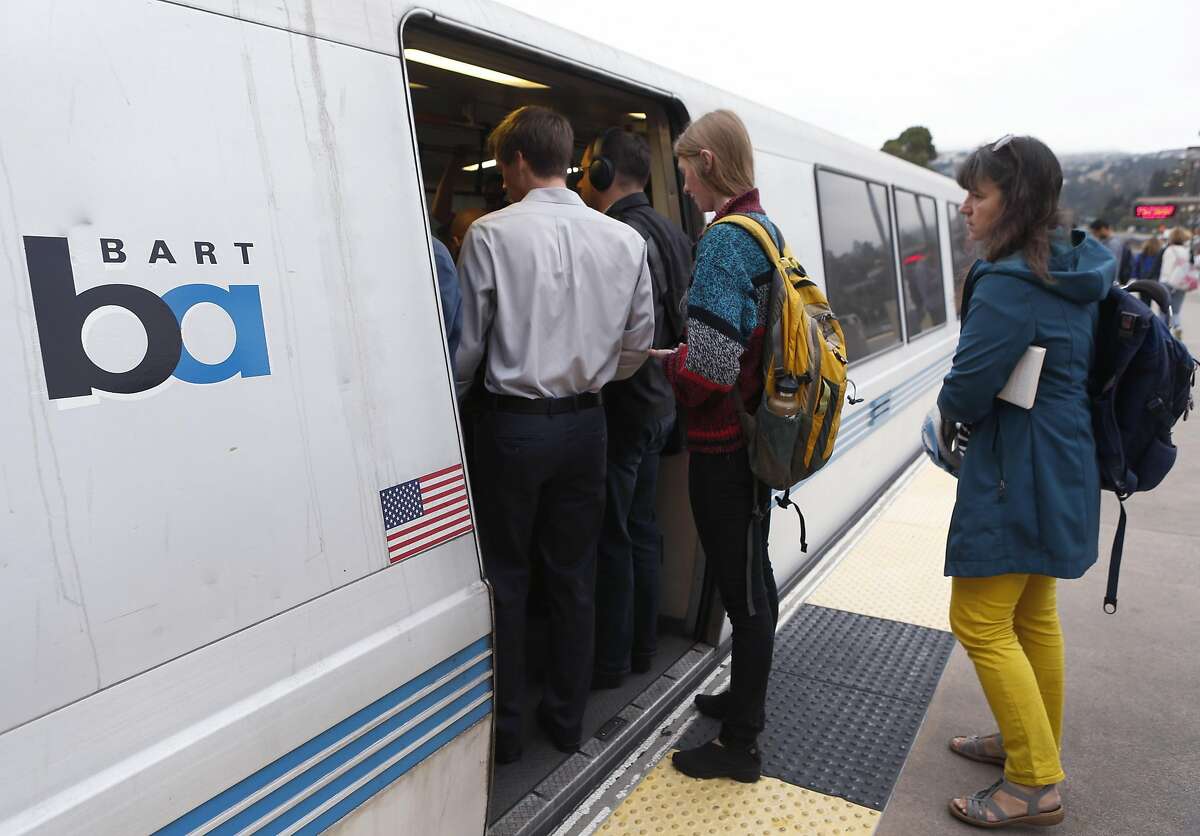 Commuters try to squeeze into a San Francisco-bound train at the Rockridge BART station in Oakland on Wednesday, Oct. 12, 2016. BART officials are hoping voters will approve a $3.5 million bond measure to improve the aging infrastructure of the transit system.