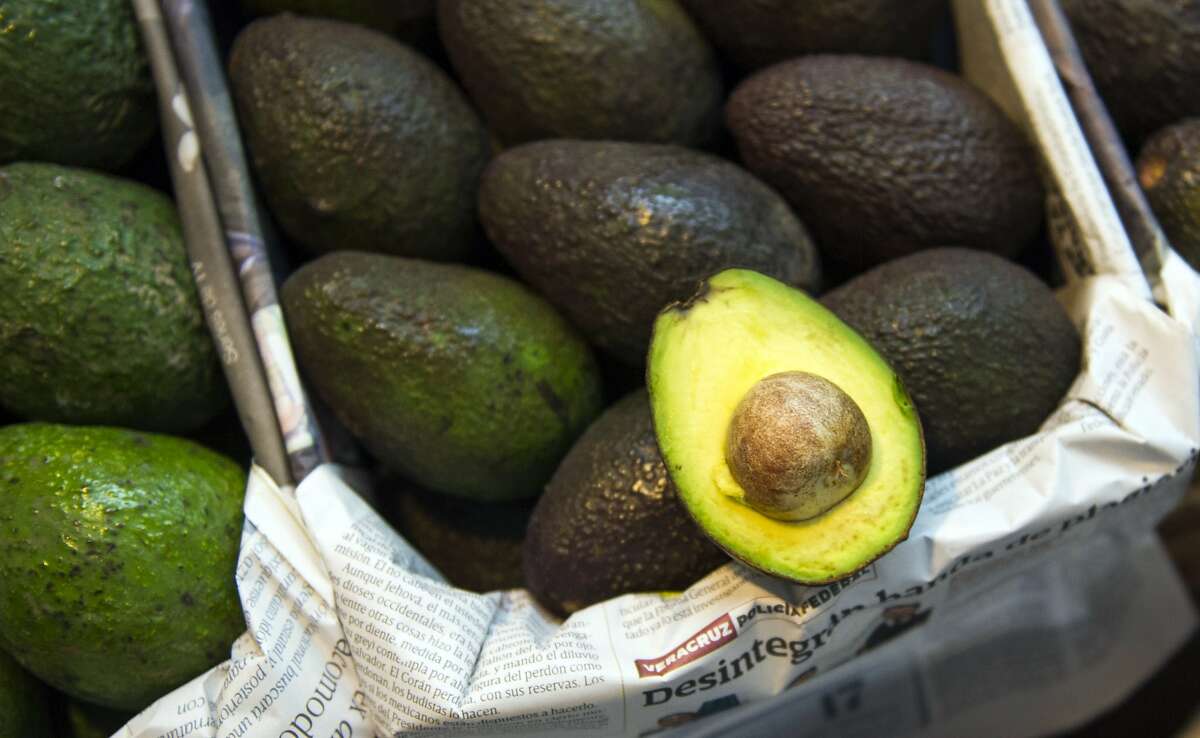 Avocados are displayed for sale in a large market in Mexico City, Tuesday, Aug. 9, 2016. Avocado trees flourish at about the same altitude and climate as the pine and fir forests of Michoacan, the state that produces most of Mexico?•s avocados. That has led farmers to fight a game of cat-and-mouse with authorities, thinning the forests and planting young avocado trees under the canopy. (AP Photo/Nick Wagner)