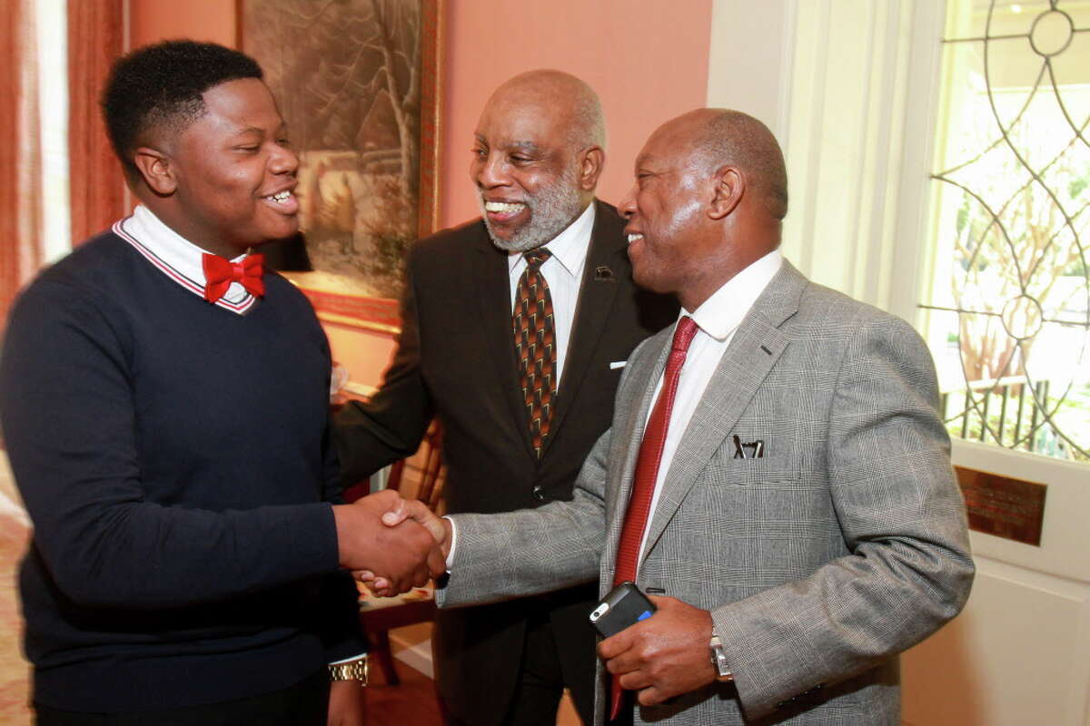 FWEP alumni Stephen Norman, from left, and executive director Charles Savage, with Mayor Sylvester Turner at the Fifth Ward Enrichment Program's 15th annual luncheon. (For the Chronicle/Gary Fountain, October 13, 2016)