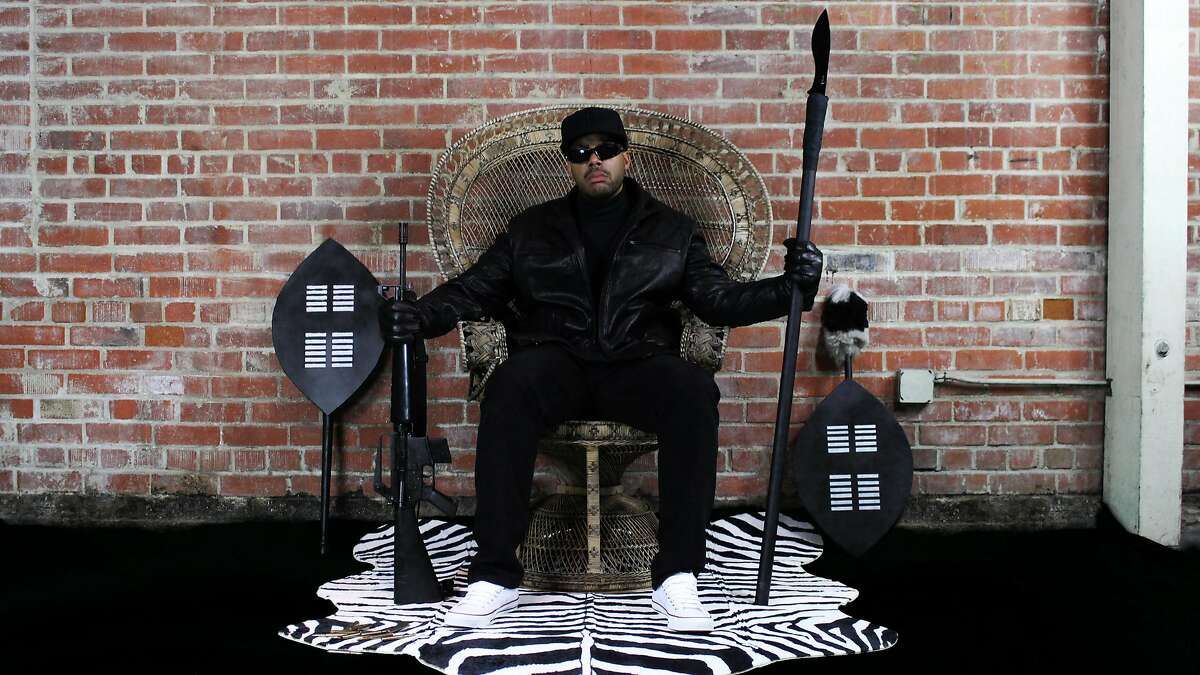San Francisco-based rapper Paris re-creates the famous wicker chair photo the of Black Panthers co-founder Huey Newton.
