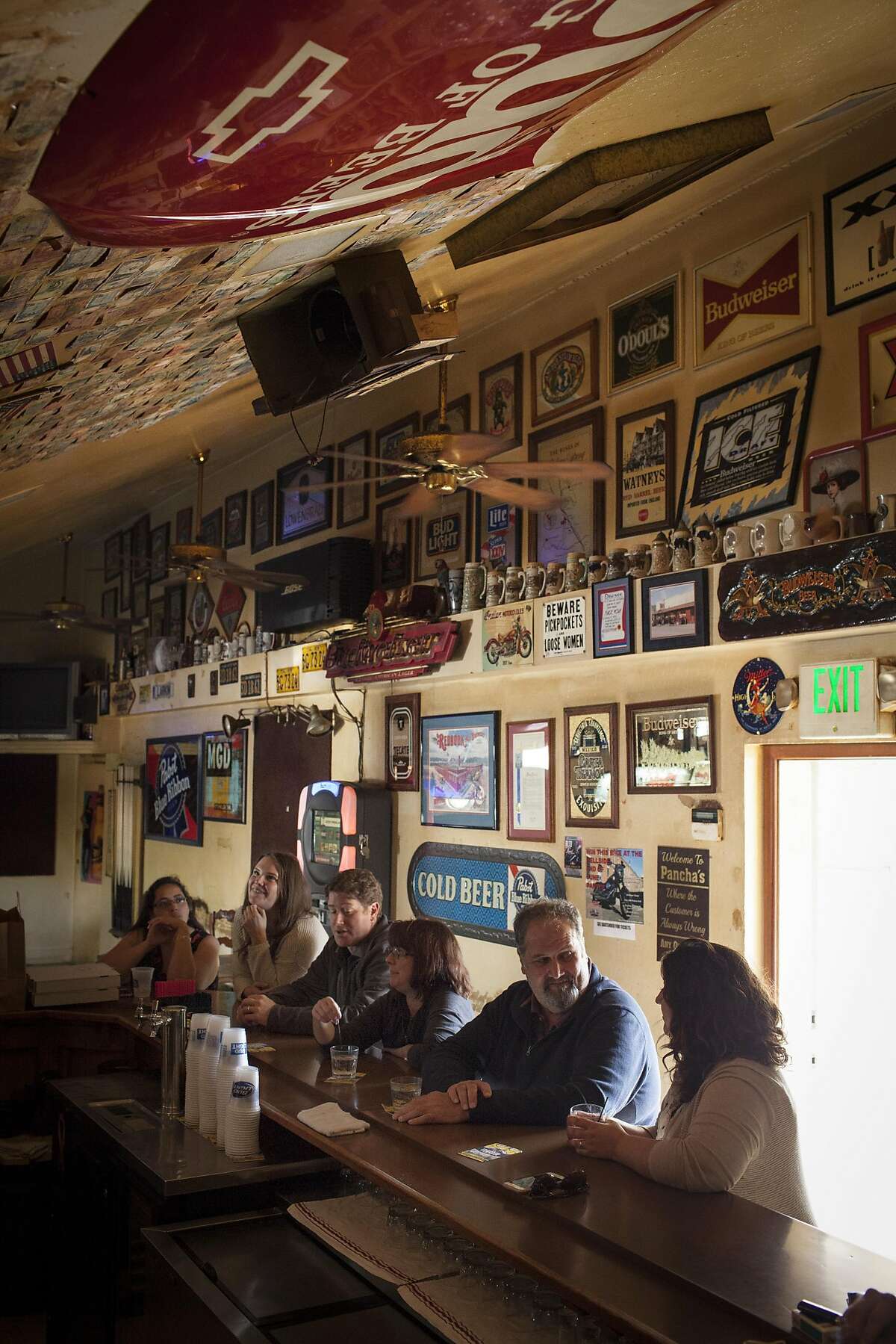 Patrons drink beers and cocktails at Panchas bar in Yountville, California, USA 12 Oct 2016, which caters to mainly wine industry workers and locals. (Peter DaSilva/Special to The Chronicle)