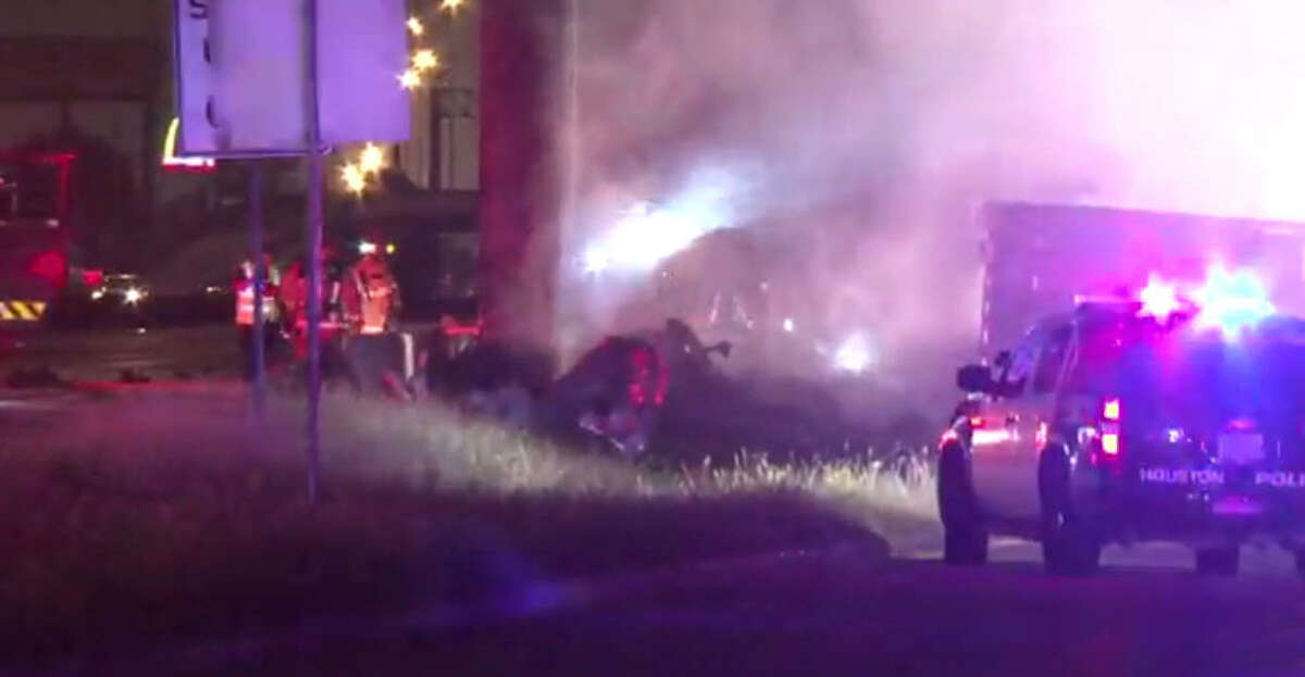 A man died and his two young sons were injured when their big rig moving van overturned and burst into flames about 1:15 a.m. Friday, Oct. 14, 2016, on the southbound North Freeway in north Houston. (Metro Video) 