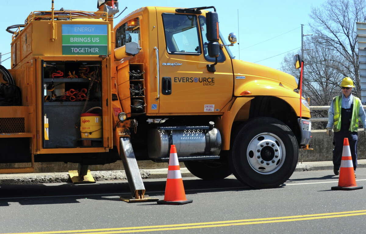 FILE — Eversource work crews on the scene at the corner of Hales Road and and Greens Farm Road in Westport, Conn. on Friday, April 15, 2016.