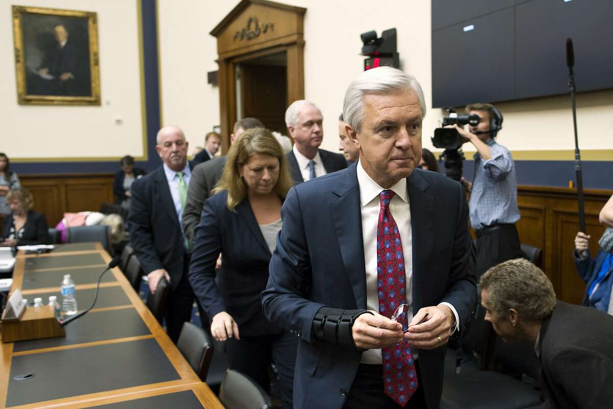FILE - In this Thursday, Sept. 29, 2016, file photo, Wells Fargo CEO John Stumpf leaves a hearing room on Capitol Hill in Washington, after testifying before the House Financial Services Committee investigating Wells Fargo's opening of unauthorized customer accounts. Embattled CEO Stumpf is out effective immediately, with President and Chief Operating Officer Tim Sloan taking over as the head of the one of the nation�s largest banks, the company announced Wednesday, Oct. 12, 2016. (AP Photo/Cliff Owen)