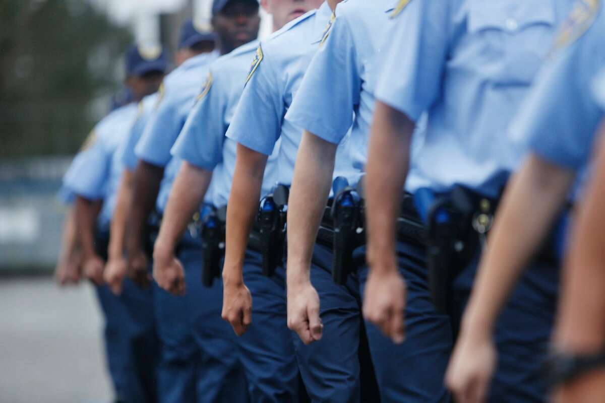 The arms of San Francisco Police recruits from the the 246th recruit class swing together as they march in formation during an exercise at the San Francisco Police Academy Regional Training Center on Wednesday, June 10, 2015 in San Francisco, Calif.