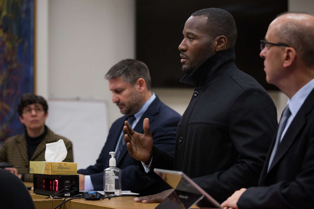 Former Seahawk Derrick Coleman, second from right, addresses the court during his sentencing.