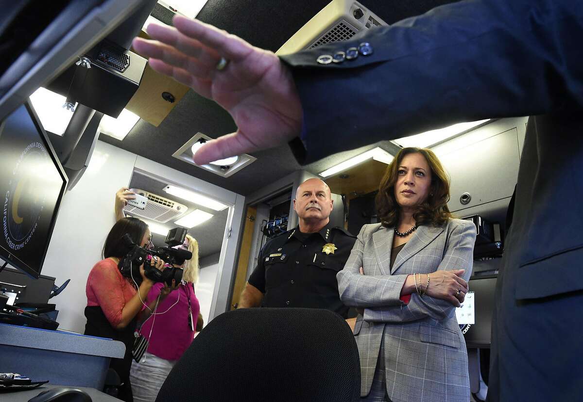 State Attorney General Kamala Harris and Fresno Chief Jerry Dyer get a tour from Department of Justice software specialist Tim Whitfield, right, of the Cyber Response Vehicle (CRV), at Fresno State, Monday afternoon, Oct. 10, 2016, which will help local law enforcement throughout California perform efficient and advanced criminal investigations with a technology component like e-mail recovery, social media investigations, and advanced mobile forensics.