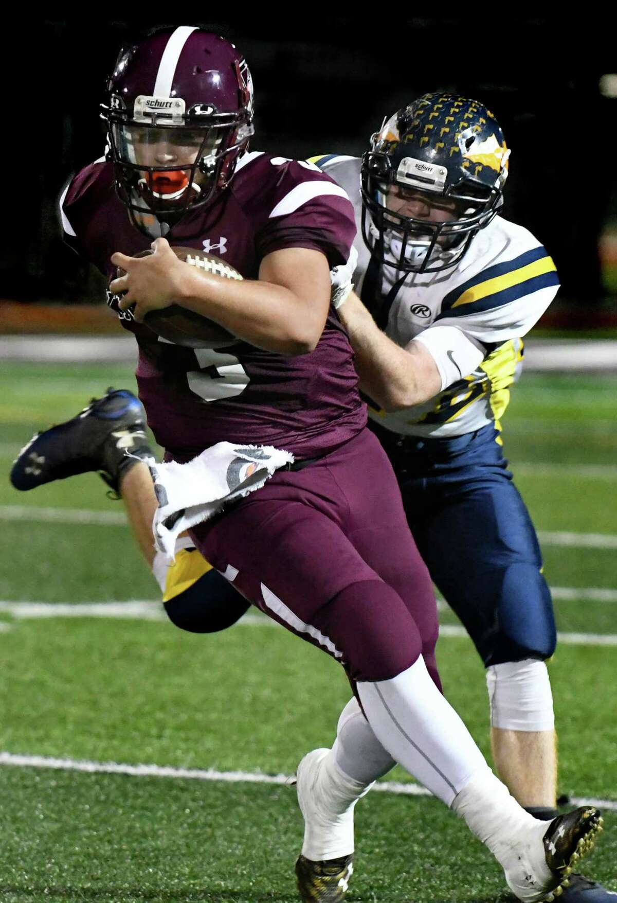 Lansingburgh's Mike Zanda, left, carries the ball as Averill Park's Dennon Fisher defends during their football game on Friday, Oct. 14, 2016, at Lansingburgh High in Troy, N.Y. (Cindy Schultz / Times Union)