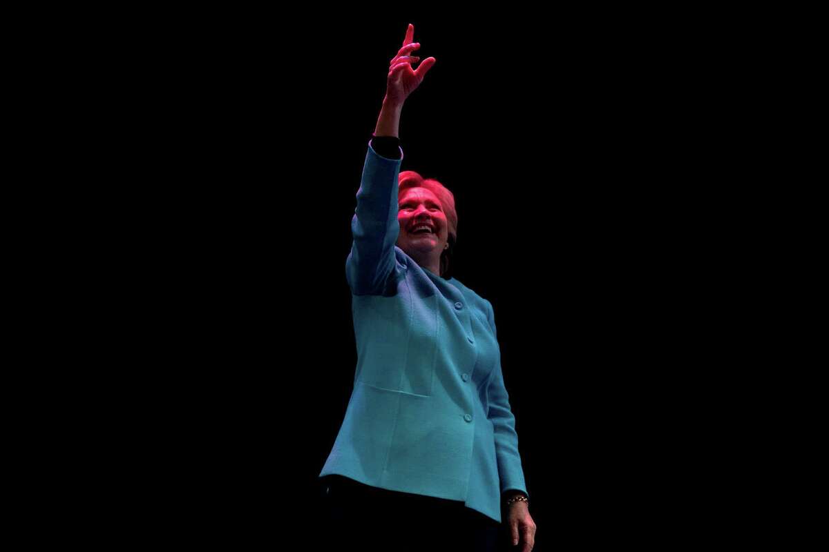Democratic presidential candidate Hillary Clinton waves to the crowd after speaking at a fundraiser at the Paramount Theatre in Seattle, Friday, Oct. 14, 2016.