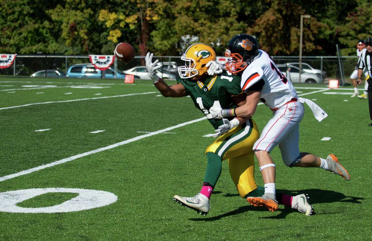 Trinity Catholic's Gerardo Gonzalez reaches for a pass during Saturday's game against Ridgefield on October 15, 2016.
