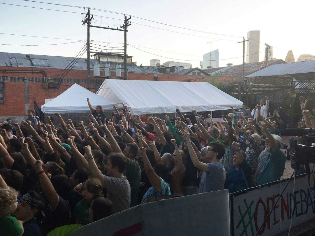 Green Party candidate Jill Stein spoke to crowd as they did a fist-raised group selfie at Last Concert Cafe on Saturday, Oct. 15, 2016 in Houston.