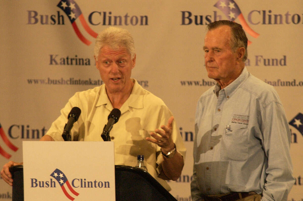 Former Presidents Bill Clinton, left, and George H.W. Bush during a press conference in Houston before meeting with Hurricane Katrina evacuees, Monday, Sept. 5, 2005 (AP Photo/Chronicle/Carlos Rios)
