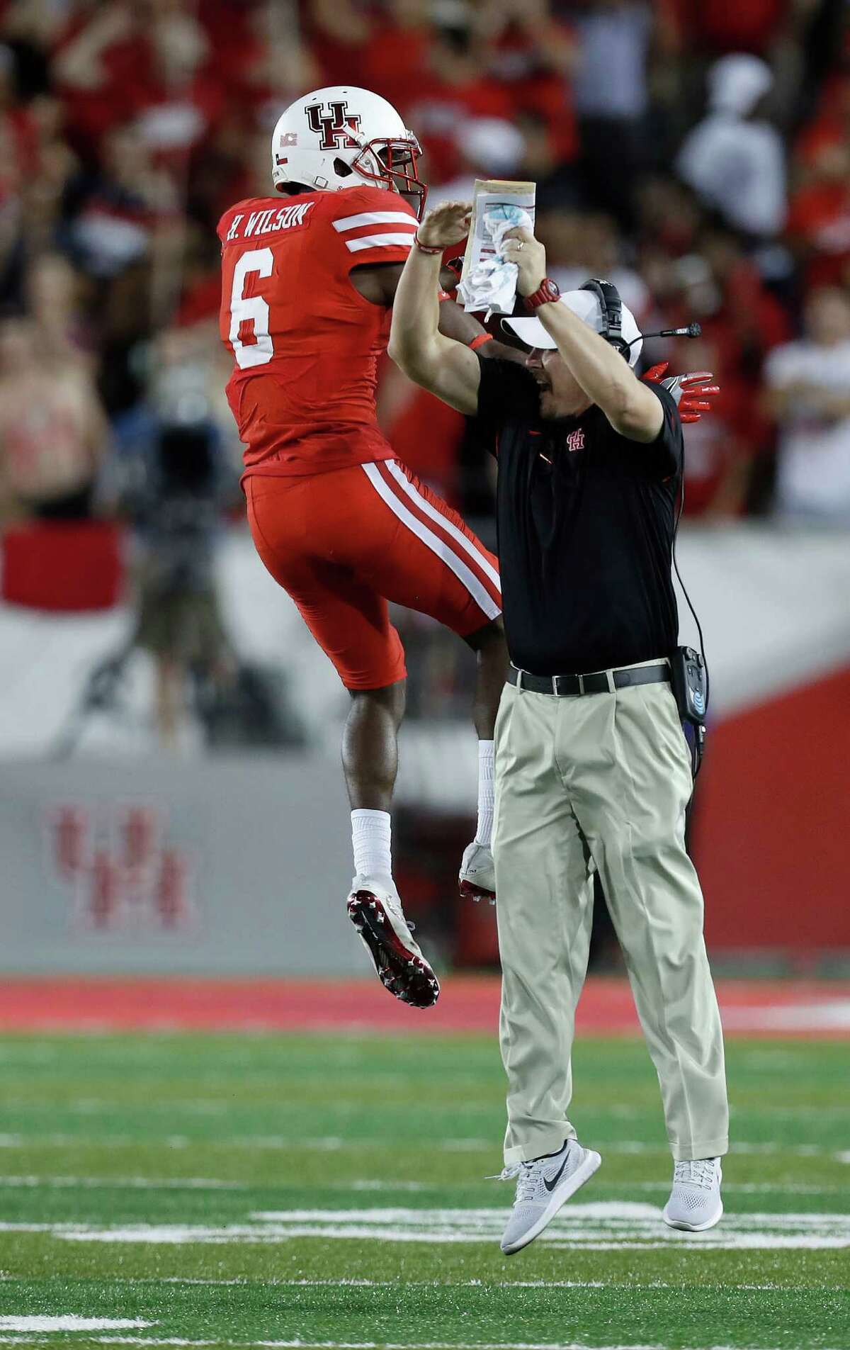 Houston Cougars cornerback Howard Wilson (6) celebrates his interception of a Tulsa pass with head coach Tom Herman during the second quarter of an NCAA college football game at TDECU Stadium, Saturday,Oct. 15, 2016 in Pearland. ( Karen Warren / Houston Chronicle )