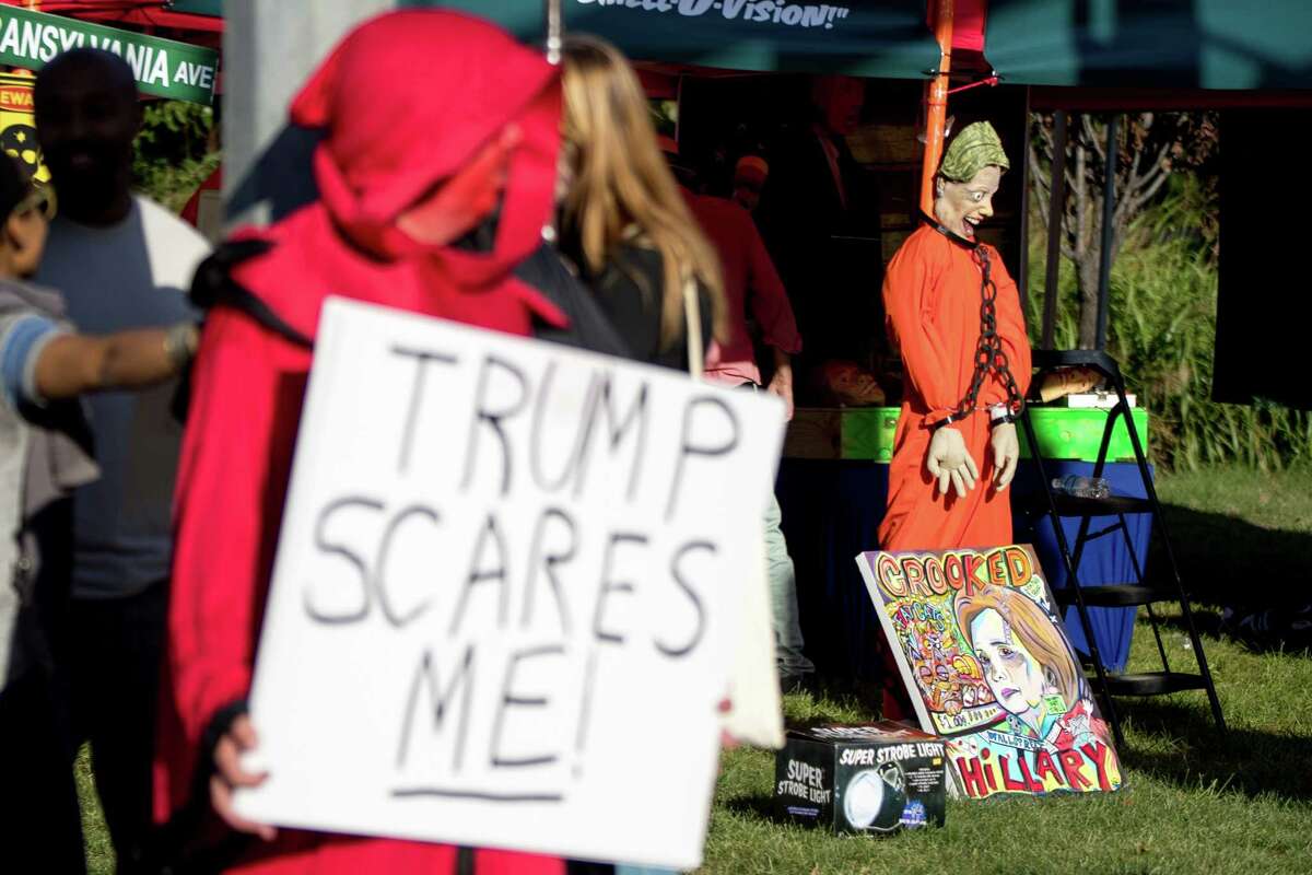 ﻿Activists, some in Halloween costumes, gather on Oct. 9 in St. Louis before the second presidential debate. Observers say this election cycle has lost the decorum and policy-driven debate that marked elections of the past.