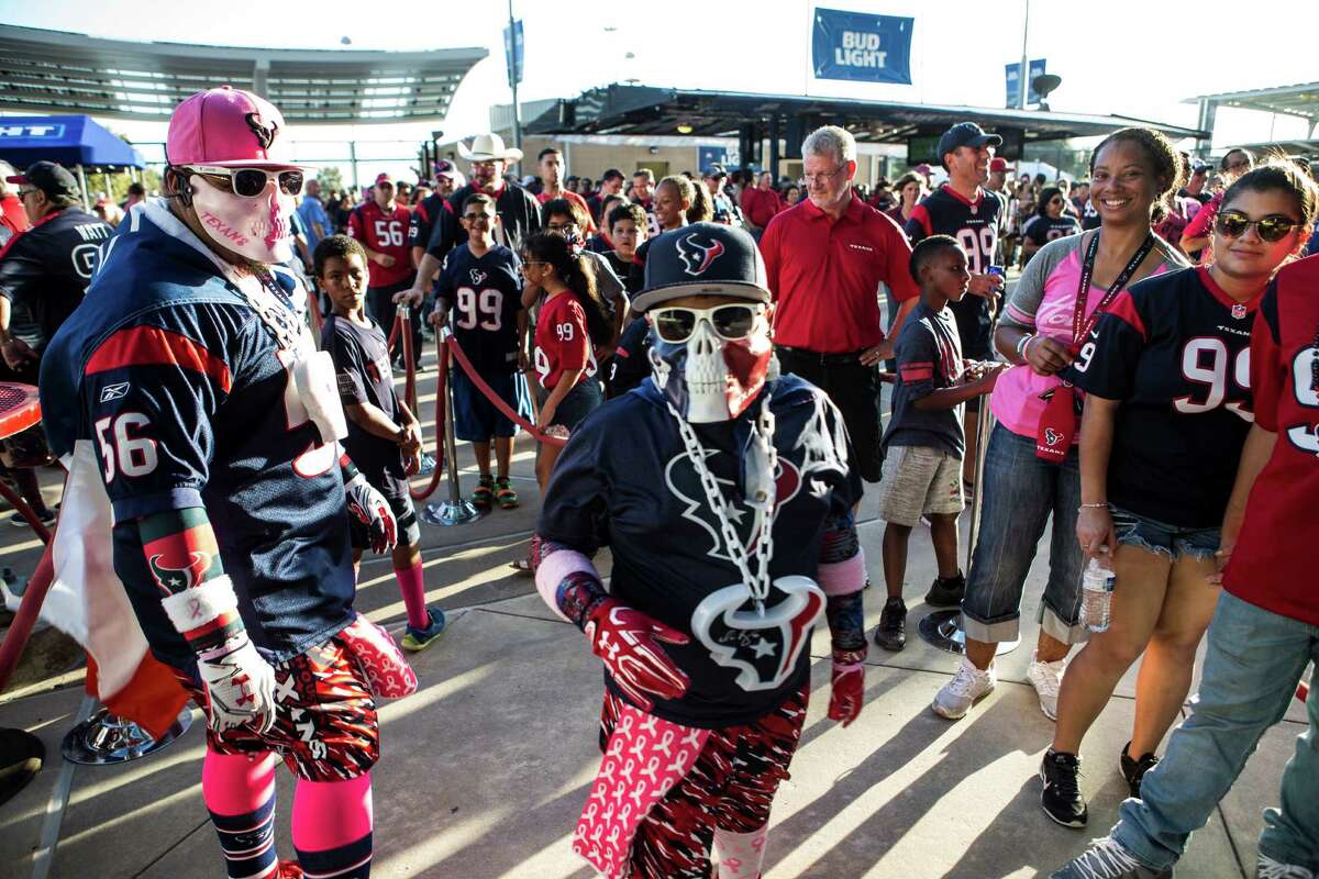 Fans tailgate prior to an NFL football game between the Houston