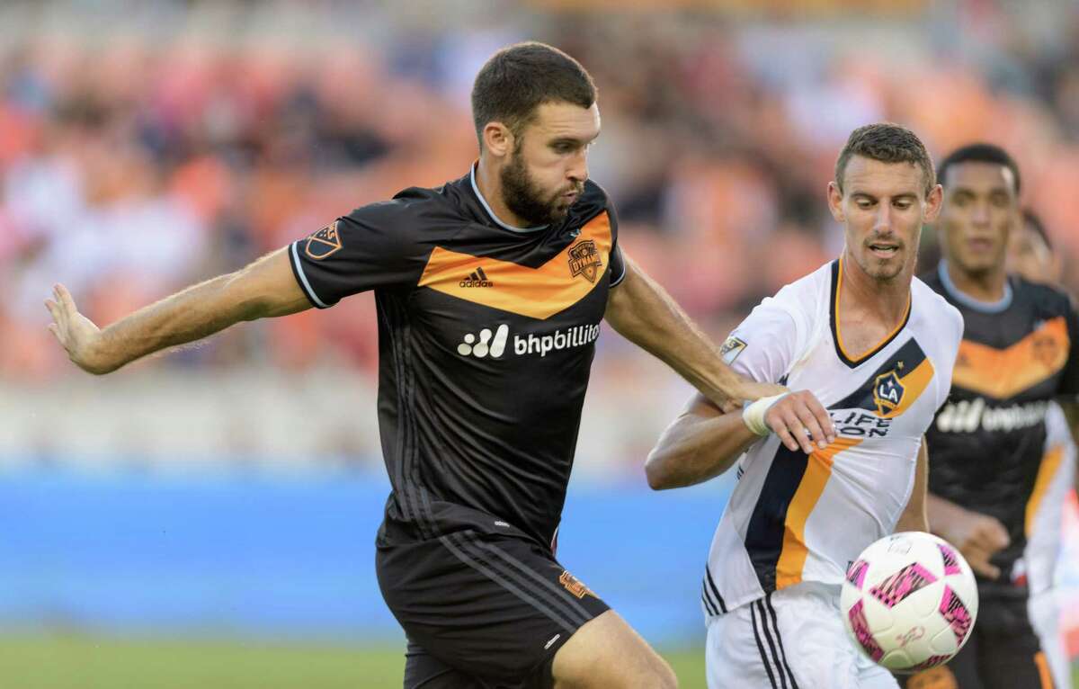 Will Bruin (12) of the Houston Dynamo battles Daniel Steres (44) of the LA Galaxy for the ball in the first half of an MLS game on Sunday, October 16, 2016 at BBVA Compass Stadium in Houston Texas.