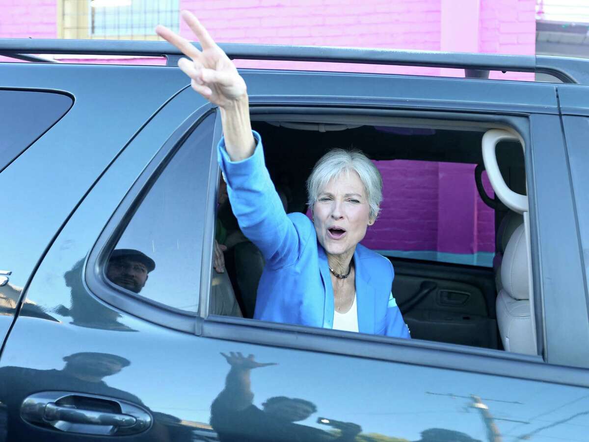 Green Party presidential candidate Jill Stein waves to supporters as she leaves a campaign stop at Galeria E.V.A Sunday Oct. 16, 2016.