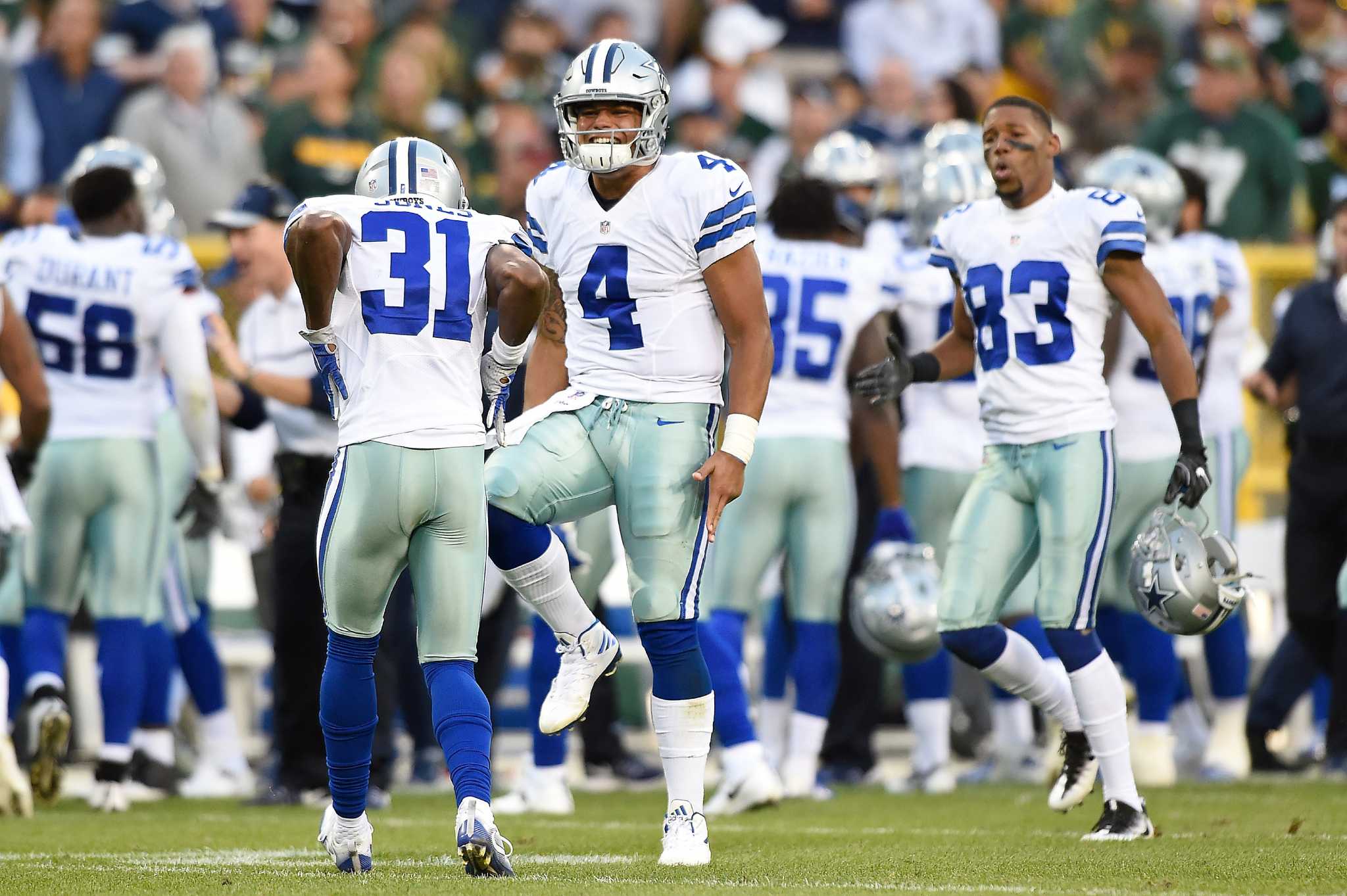 Dallas Cowboys quarterback Dak Prescott throws a pass in the third