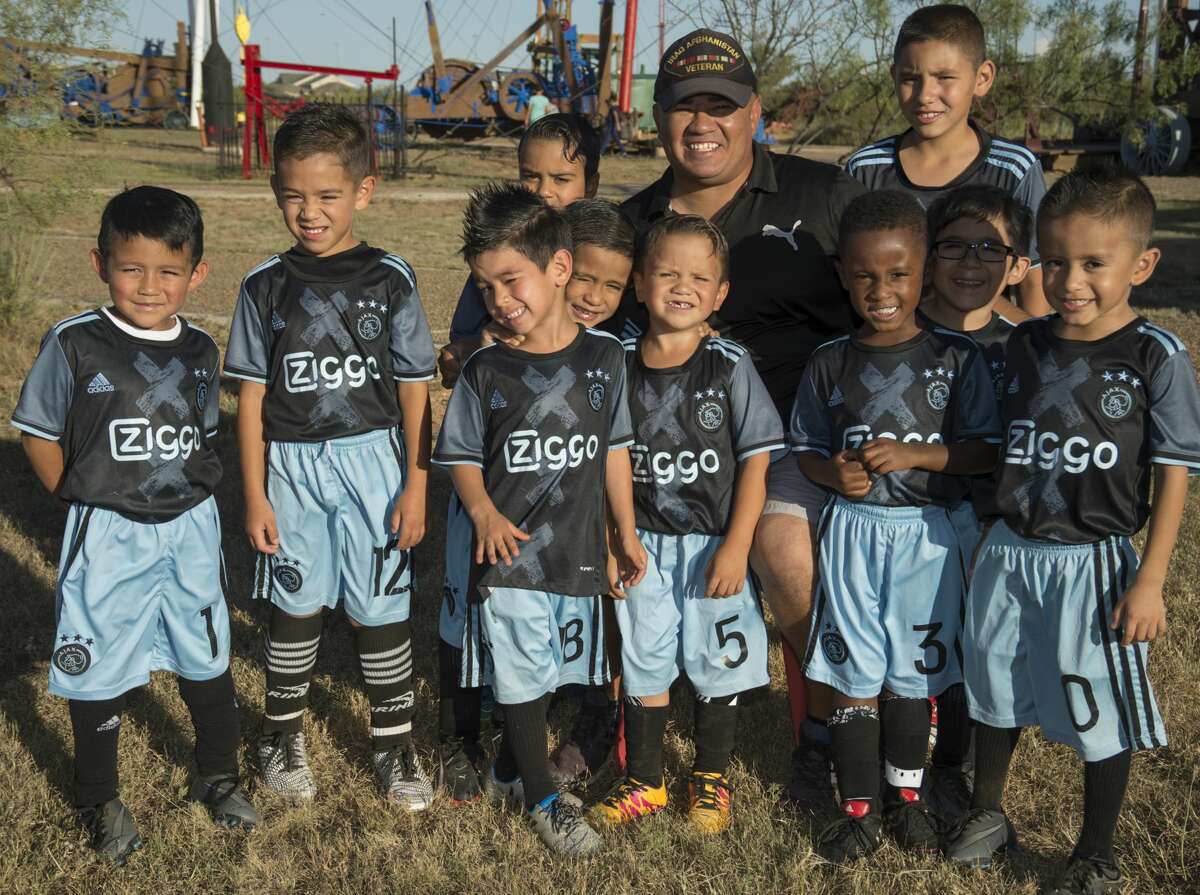 One of the 52 Faces of our Community, Israel Ramirez with some of the youth he coaches. Tuesday 10-04-16 Tim Fischer/Reporter-Telegram