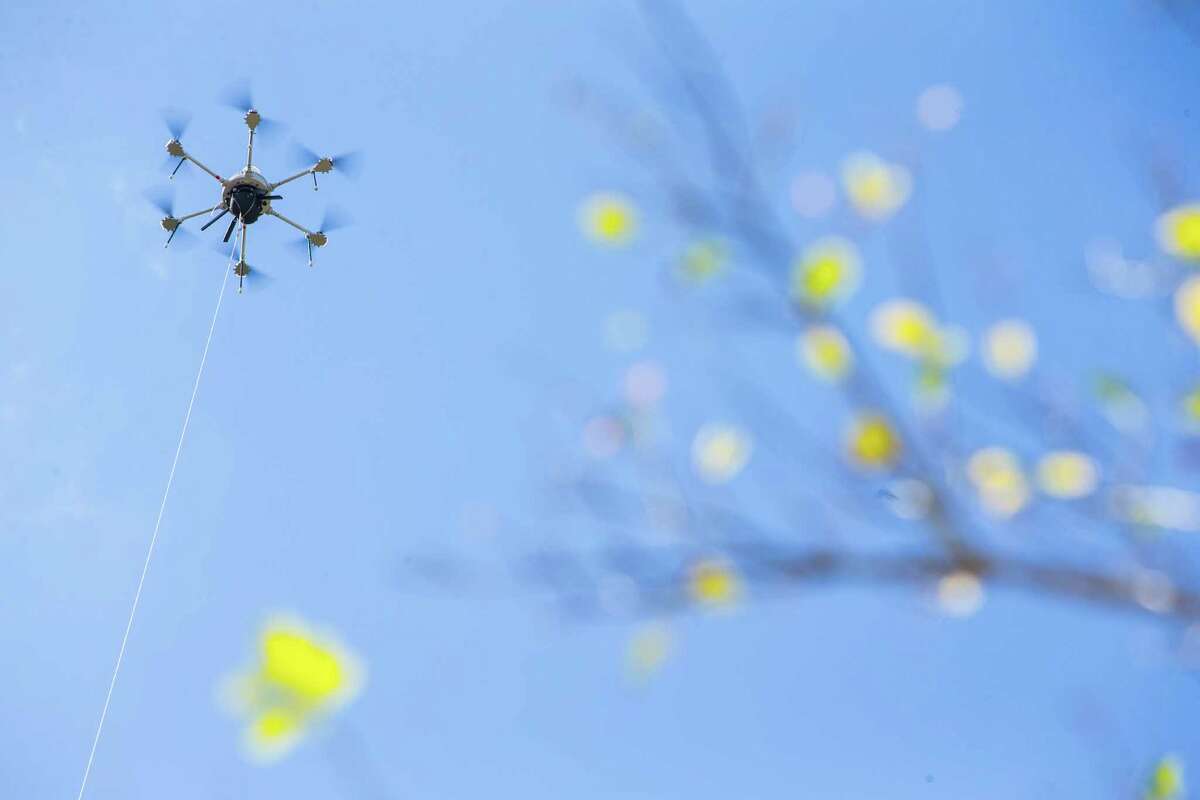 A drone takes flight during a tethered drone system demonstration at the new Intuitive Machines facility at the Houston Spaceport on Monday, Oct. 17, 2016, in Houston. The drone flew to 400 feet and performed a surveillance demonstration including assent tracking, real time monitoring. ( Brett Coomer / Houston Chronicle )