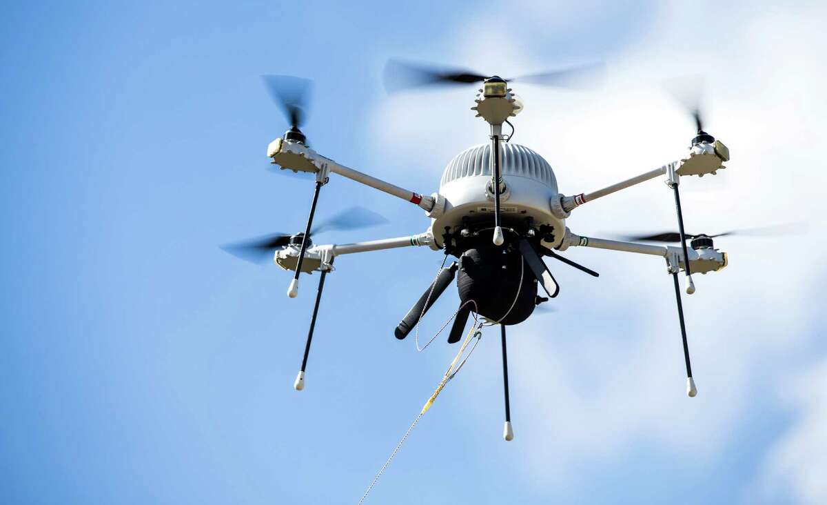 A tethered drone takes flight Monday at the Houston Spaceport. It captured video of vessels and automobiles.﻿
