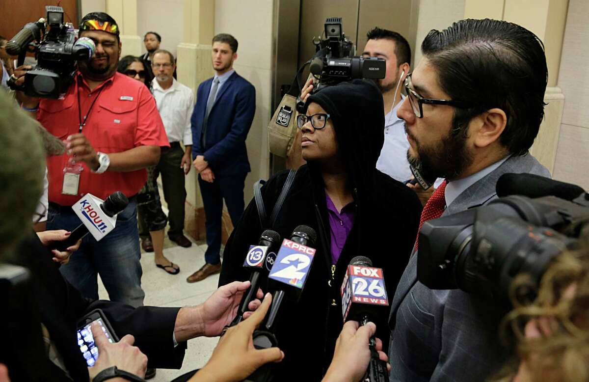 Crenshanda Williams center after her appearance before Judge John Clinton in County Criminal Court at Law #4 on two misdemeanor charges for interference with emergency telephone calls Oct. 17, 2016, in Houston. ( James Nielsen / Houston Chronicle )