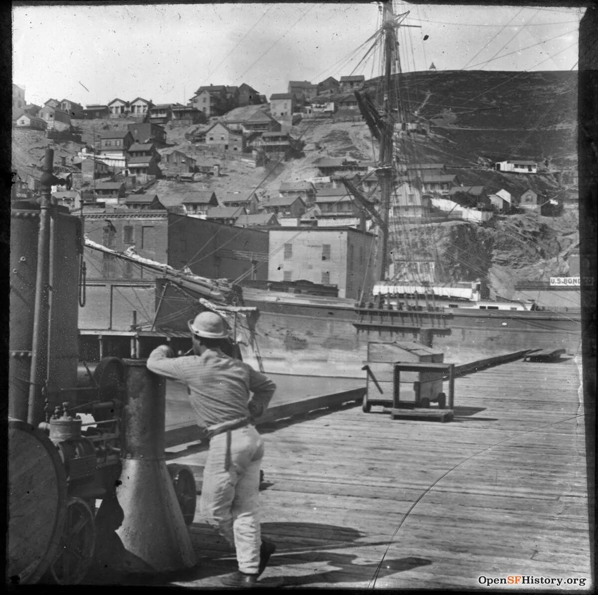 Early, undated photo of Telegraph Hill, from waterfront pier near present Embarcadero. Courtesy of OpenSFHistory.org.